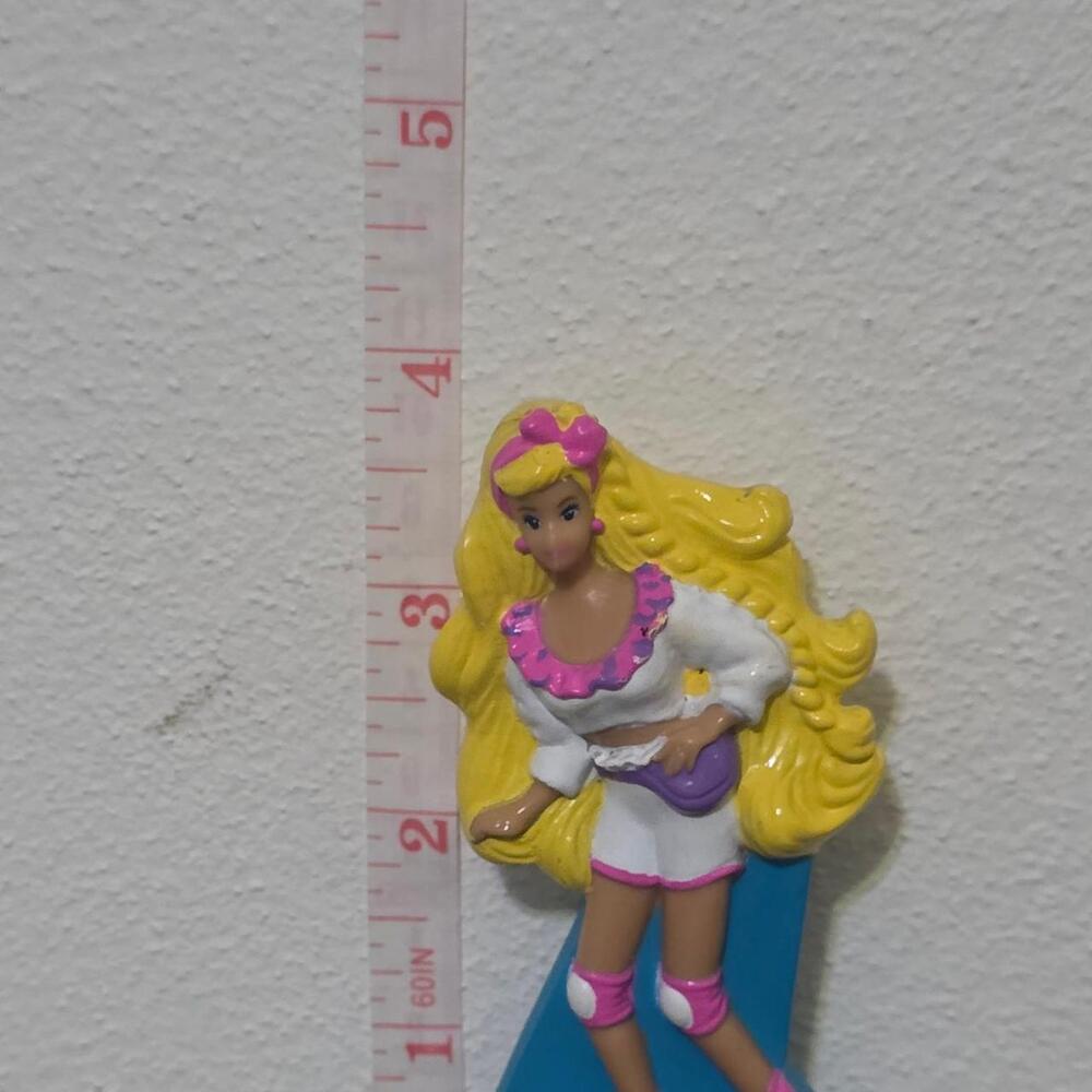 barbie figurine with pink and white outfit and yellow hair #barbie #retro